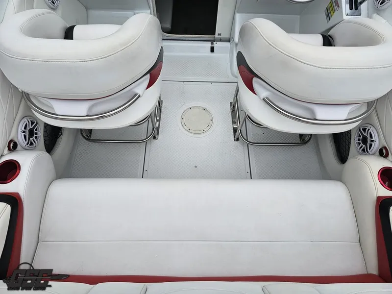 Slide: The Image of 2005 Baja 25 Outlaw boat interior with white and red seating. - 49