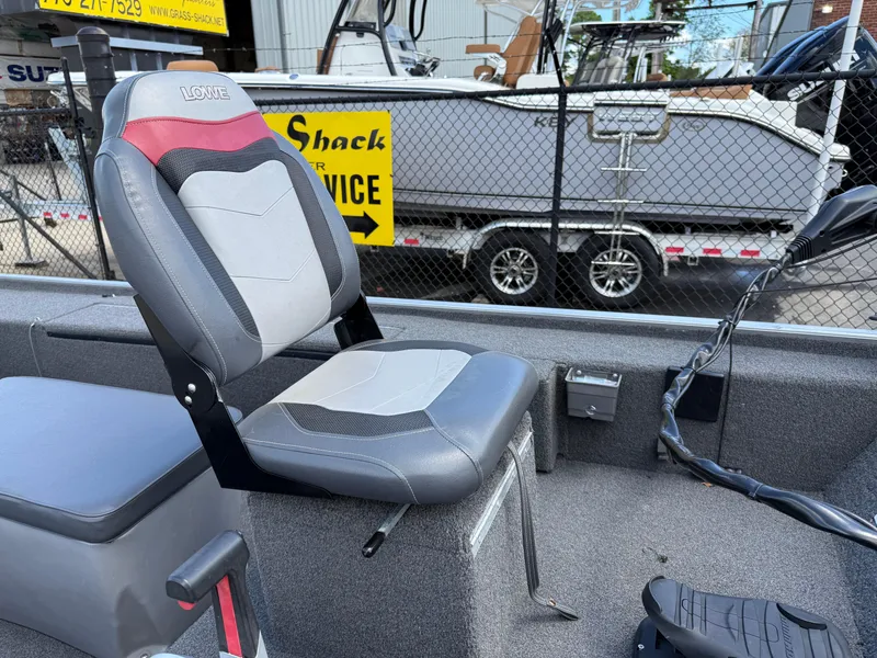 Slide: The Image of 2018 Lowe Stryker 16 boat seat with gray and red upholstery. - 12