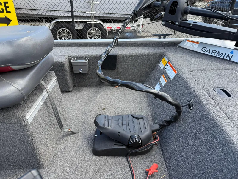 Slide: The Image of 2018 Lowe Stryker 16 boat interior with Garmin equipment and foot pedal. - 13