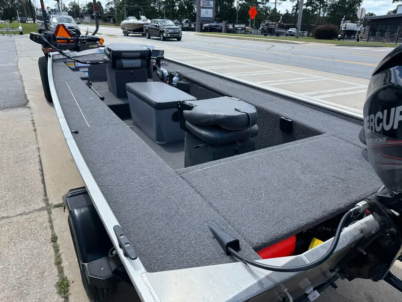 Slide: The Image of 2018 Lowe Stryker 16 boat with Mercury engine, parked on roadside. - 20