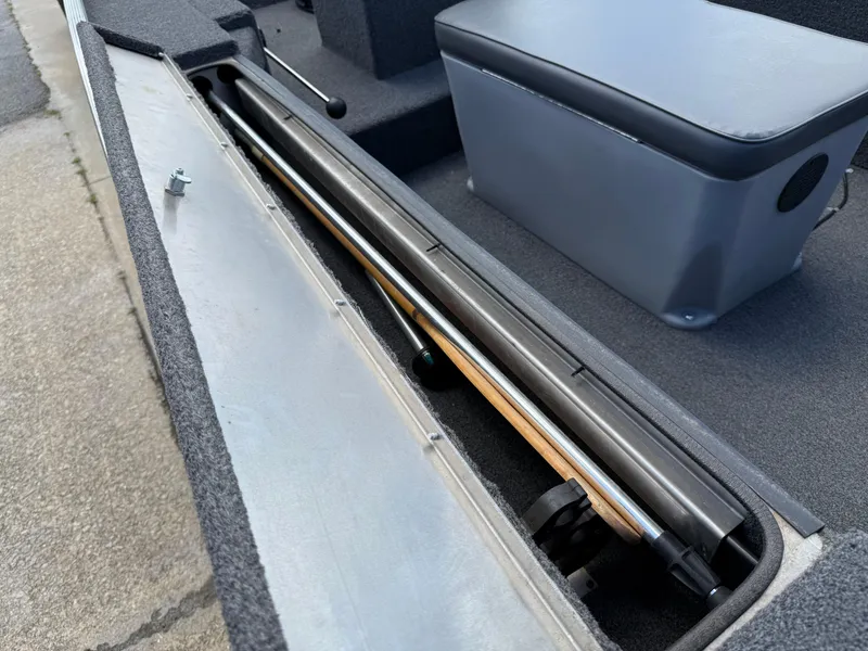 Slide: The Image of 2018 Lowe Stryker 16 boat interior with storage compartment and seating. - 21