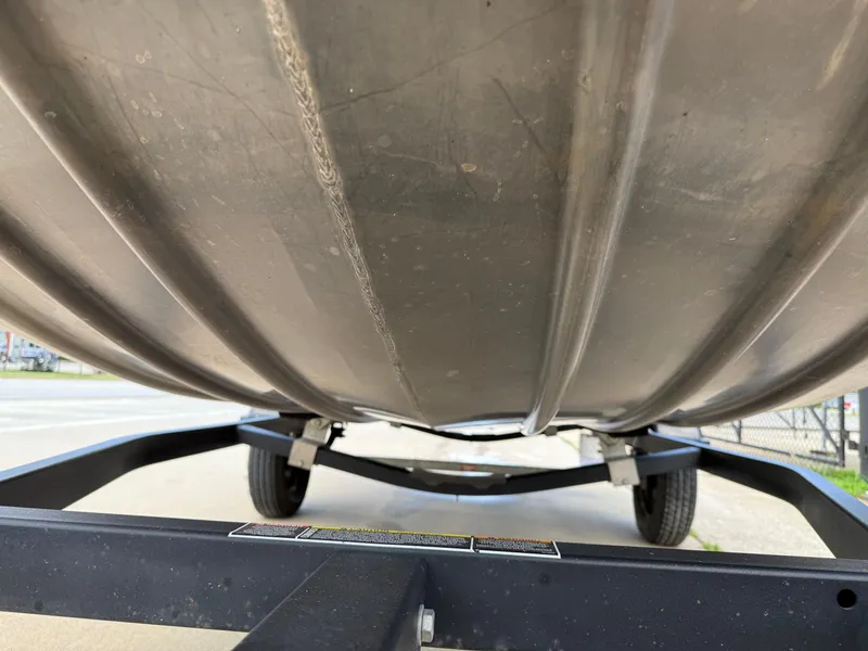 Slide: The Image of Underside view of a 2018 Lowe Stryker 16 boat on a trailer. - 28