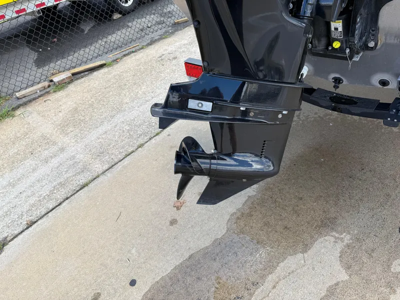 Slide: The Image of 2018 Lowe Stryker 16 boat motor and propeller on concrete surface. - 6