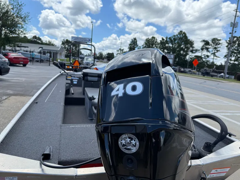 Slide: The Image of 2018 Lowe Stryker 16 boat with Mercury 40 engine in parking lot. - 7