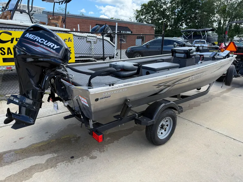 Slide: The Image of 2018 Lowe Stryker 16 boat with Mercury outboard motor on trailer. - 8