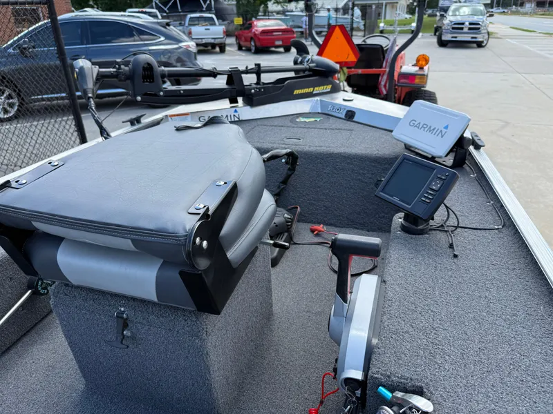 Slide: The Image of 2018 Lowe Stryker 16 boat interior with Garmin electronics and fishing equipment. - 9