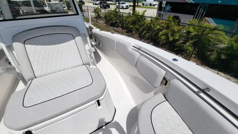 Slide: The Image of 2024 Sea Fox 288 Commander boat interior with cushioned seating and modern design. - 12