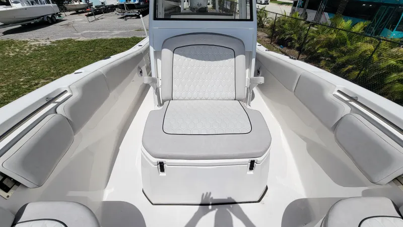 Slide: The Image of 2024 Sea Fox 288 Commander boat interior with cushioned seating and spacious layout. - 13