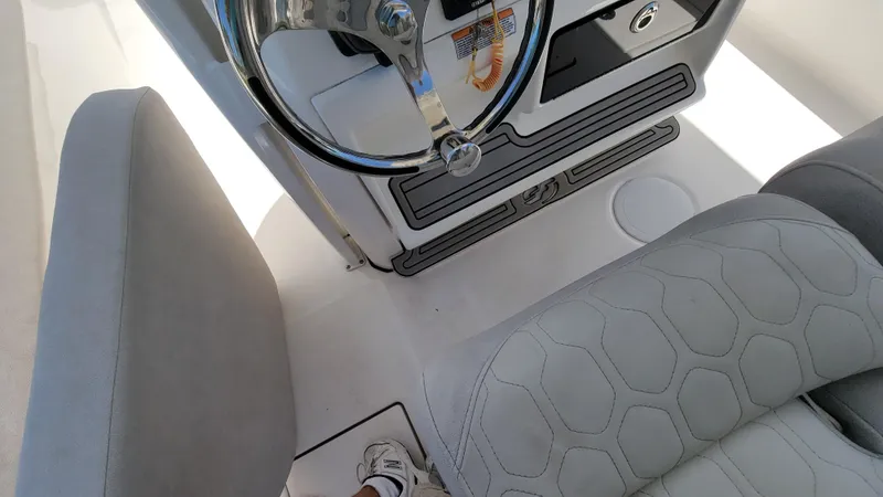 Slide: The Image of 2024 Sea Fox 288 Commander boat interior with steering wheel and seating. - 20