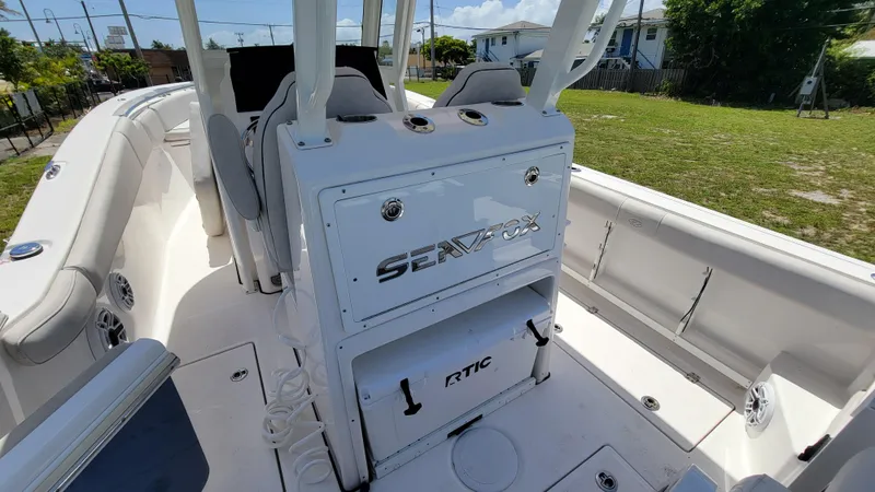 Slide: The Image of 2024 Sea Fox 288 Commander boat interior with seating and storage compartments. - 8