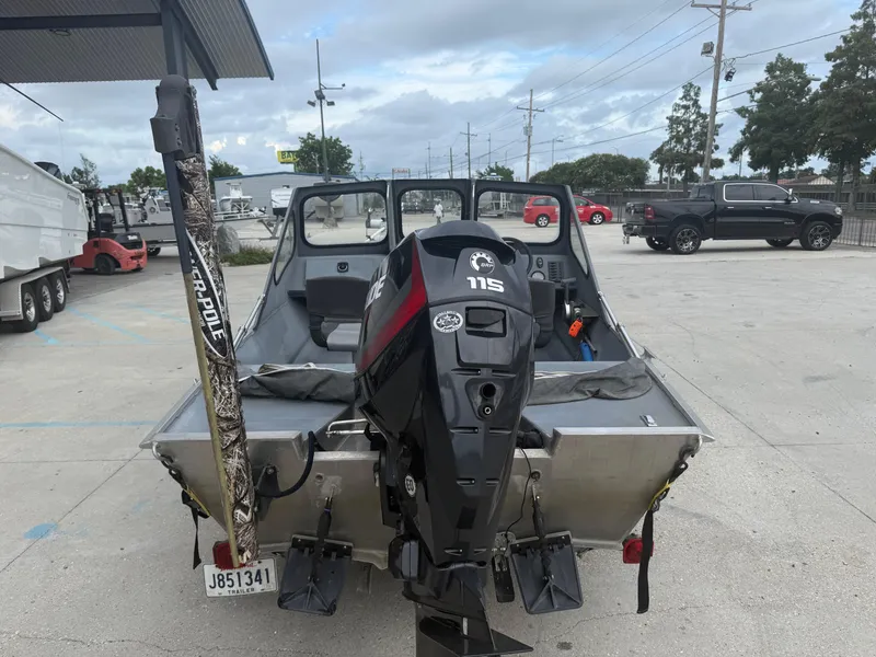 Slide: The Image of 2015 Hanko 17 boat with 115 HP engine in a parking lot. - 11