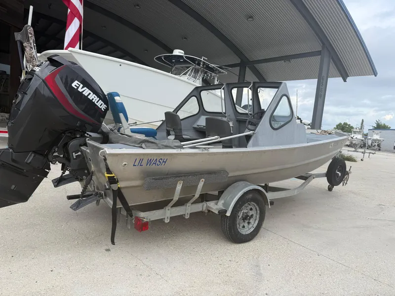 Slide: The Image of Aluminum Hanko 17 boat with Evinrude motor on trailer, 2015 model. - 13