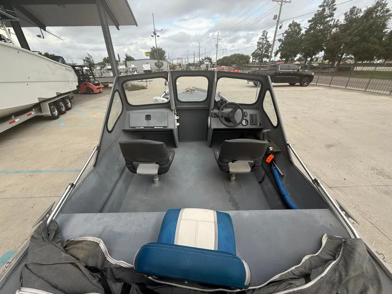 Slide: The Image of Interior view of a 2015 Hanko 17 boat with two seats and steering console. - 15