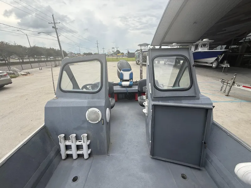 Slide: The Image of Interior view of a 2015 Hanko 17 boat, featuring dual consoles and seating. - 17