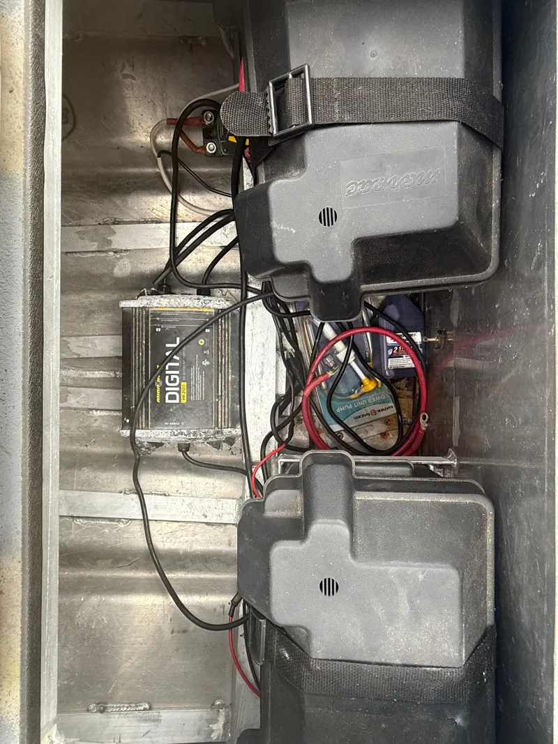 Slide: The Image of Electrical setup in a Hanko 17 boat, featuring batteries and wiring, model year 2015. - 18