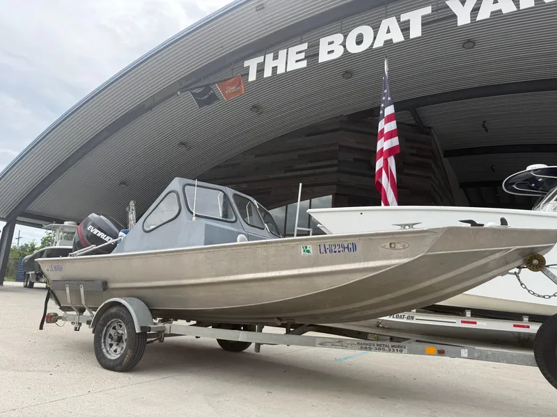 Slide: The Image of 2015 Hanko 17 boat on trailer at The Boat Yard, American flag visible. - 3