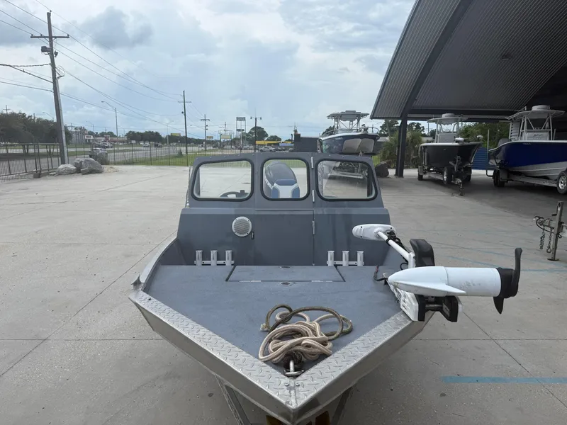 Slide: The Image of Aluminum Hanko 17 boat, 2015 model, parked outdoors with a trolling motor and rope. - 5