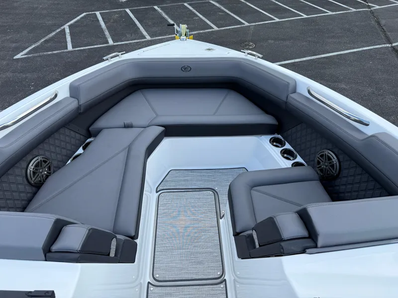 Slide: The Image of 2025 Cobalt R6 boat interior with gray seating and cup holders. - 10