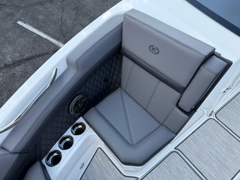 Slide: The Image of Luxurious seating area on 2025 Cobalt R6 boat with cup holders and speaker. - 12