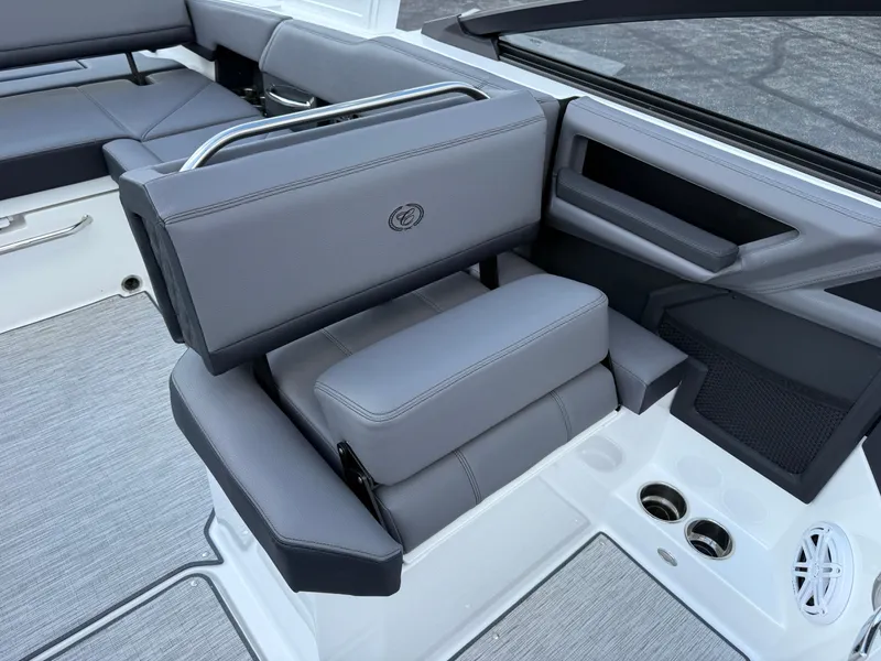 Slide: The Image of 2025 Cobalt R6 boat interior with gray seating and cup holders. - 14