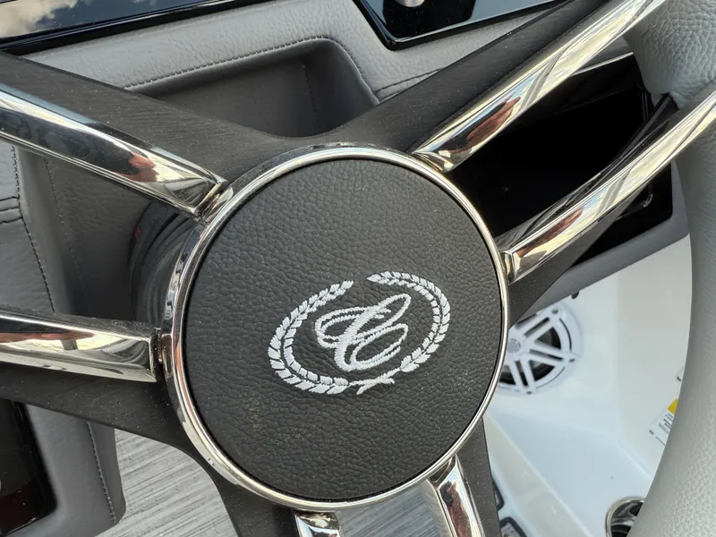 Slide: The Image of Steering wheel of 2025 Cobalt R6 boat with logo emblem. - 18