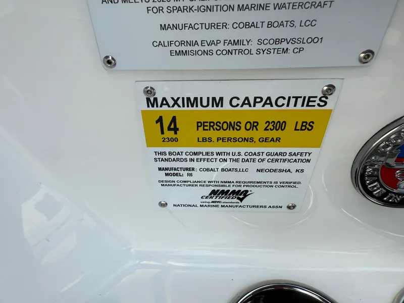 Slide: The Image of 2025 Cobalt R6 capacity label: 14 persons or 2300 lbs, U.S. Coast Guard compliant. - 23