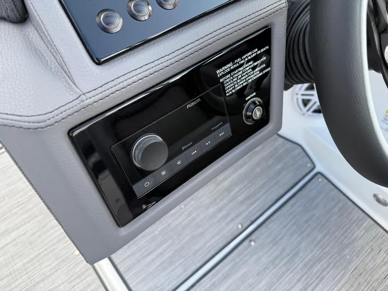 Slide: The Image of 2025 Cobalt R6 boat dashboard with Fusion audio system and control panel. - 24