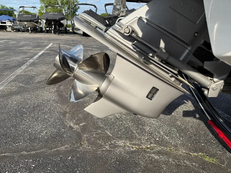 Slide: The Image of 2025 Cobalt R6 boat propeller on asphalt, showcasing sleek design and metallic finish. - 35