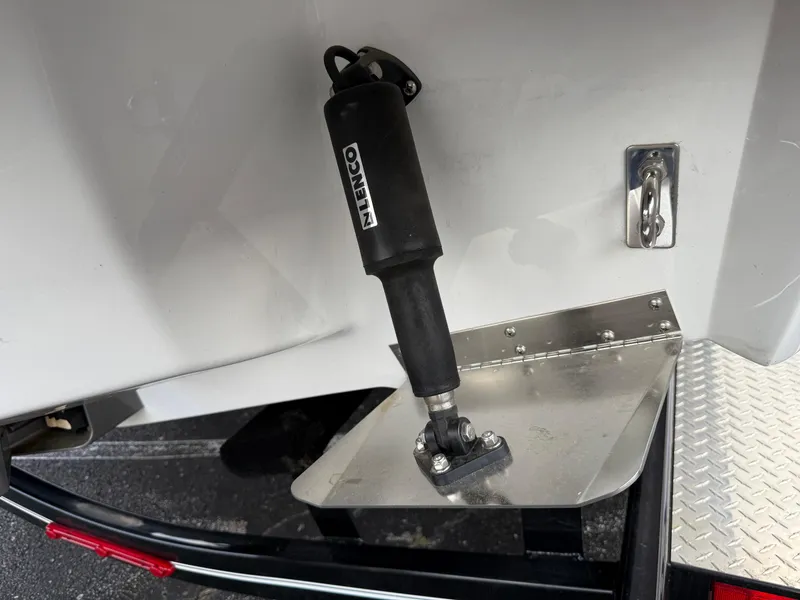 Slide: The Image of 2025 Cobalt R6 boat trim tab with Lenco actuator on a trailer. - 6