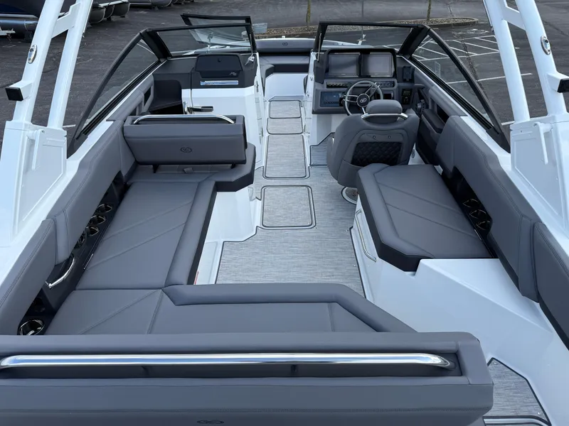 Slide: The Image of 2025 Cobalt R6 boat interior with sleek gray seating and modern dashboard design. - 8