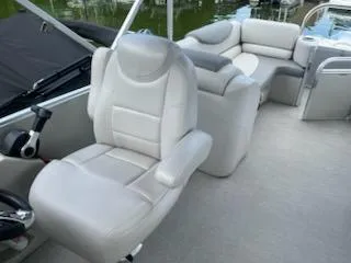 Slide: The Image of 2018 Avalon Catalina 2385QL boat interior with plush seating and modern design. - 5