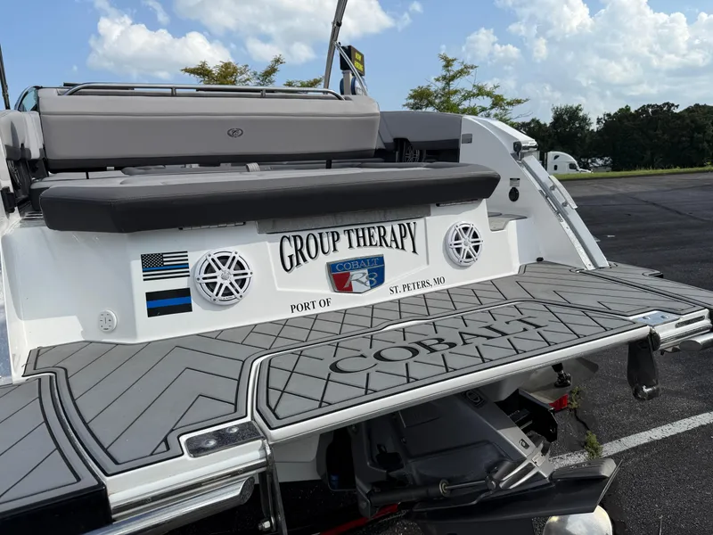 Slide: The Image of 2022 Cobalt R8 boat with "Group Therapy" name, docked in St. Peters, MO. - 10