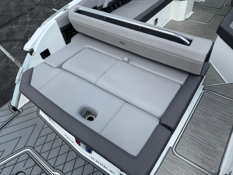 Slide: The Image of 2022 Cobalt R8 boat with gray cushioned seating and sleek design. - 14