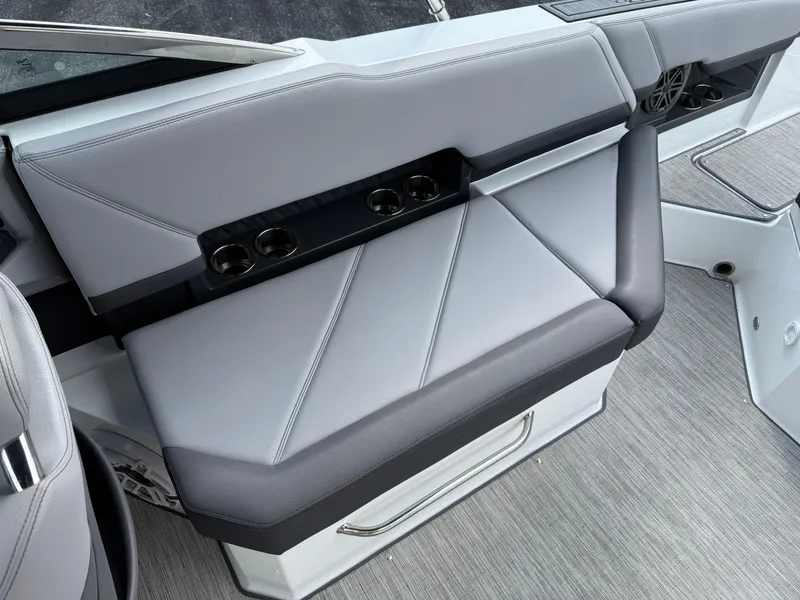 Slide: The Image of 2022 Cobalt R8 boat interior with gray seating and cup holders. - 16