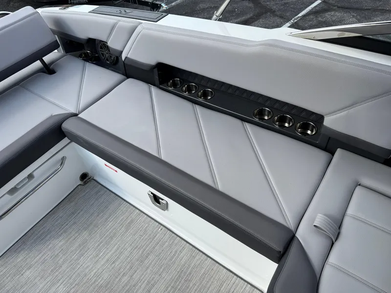 Slide: The Image of 2022 Cobalt R8 boat interior with gray seating and multiple cup holders. - 18