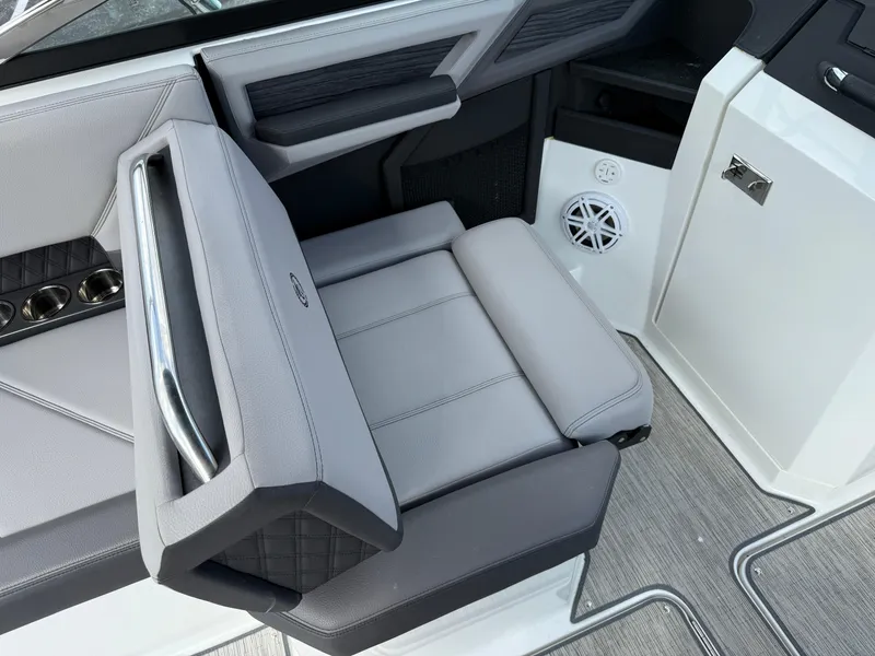Slide: The Image of 2022 Cobalt R8 boat interior with gray seating and cup holders. - 20