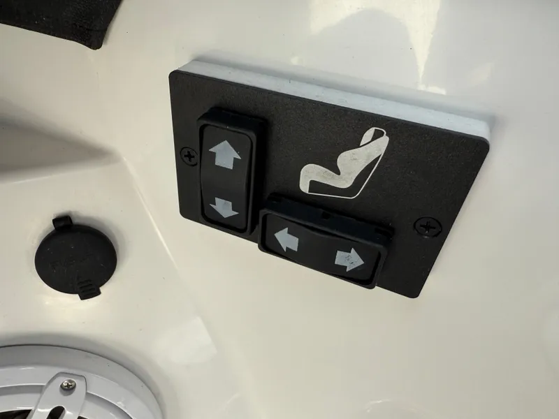 Slide: The Image of Seat adjustment controls on a 2022 Cobalt R8 boat, featuring directional buttons. - 22