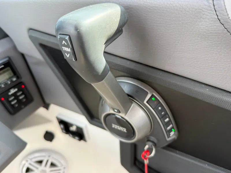 Slide: The Image of Throttle control lever in a 2022 Cobalt R8 boat cockpit. - 23