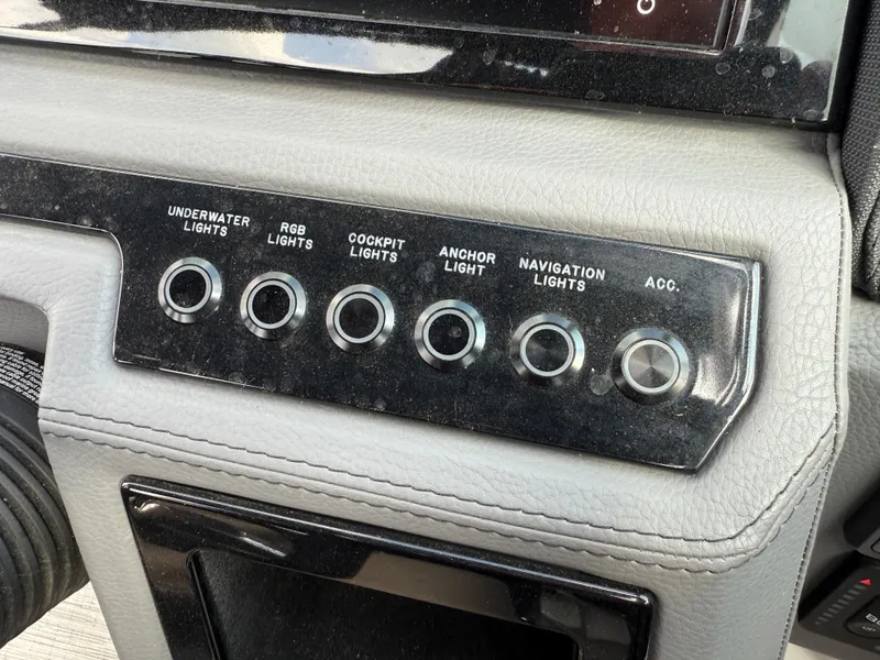 Slide: The Image of Control panel of a 2022 Cobalt R8 with various light switches. - 26
