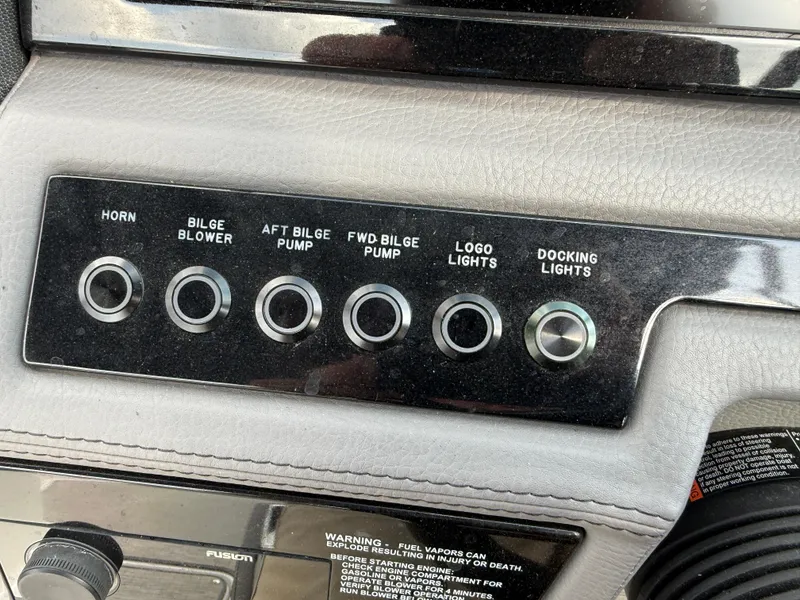 Slide: The Image of Control panel of a 2022 Cobalt R8 boat with various switches. - 28