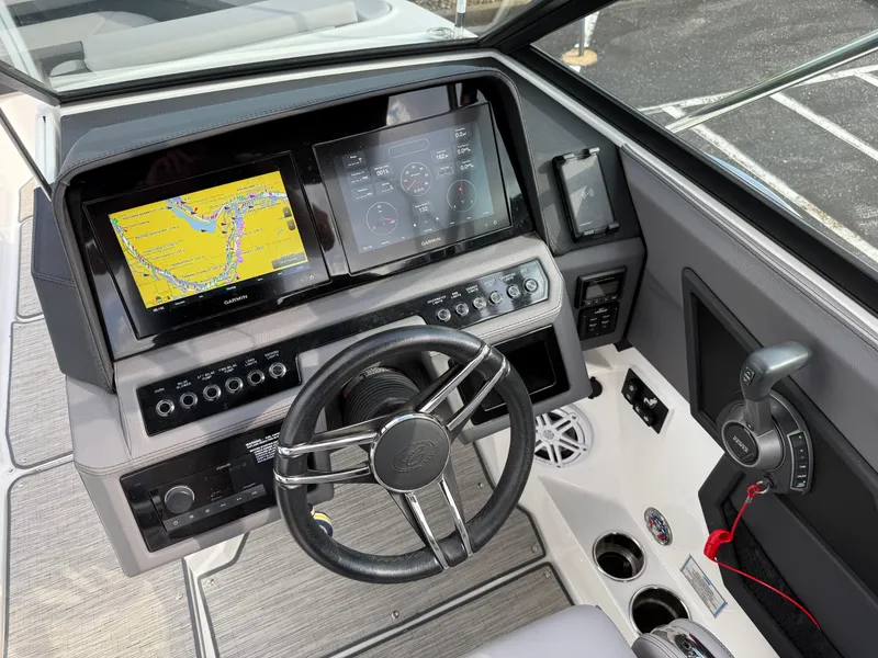 Slide: The Image of 2022 Cobalt R8 boat dashboard with Garmin navigation and control systems. - 31