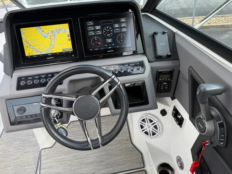 Slide: The Image of 2022 Cobalt R8 boat dashboard with Garmin navigation and control systems. - 37