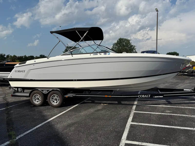 Slide: The Image of 2022 Cobalt R8 boat on trailer in parking lot under cloudy sky. - 4