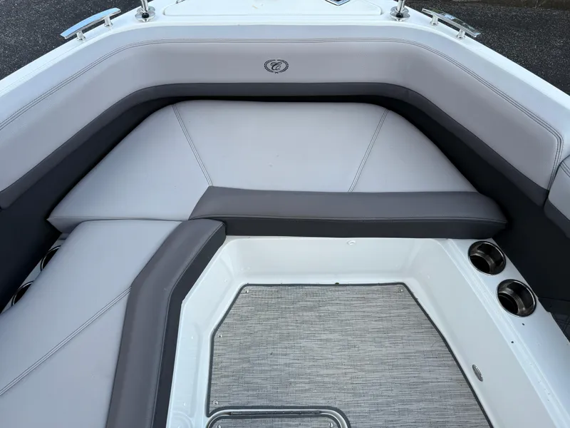 Slide: The Image of Interior seating of a 2022 Cobalt R8 boat with gray upholstery and cup holders. - 40