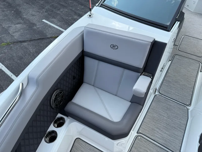 Slide: The Image of Luxurious seating on 2022 Cobalt R8 boat with cup holders and speaker. - 42