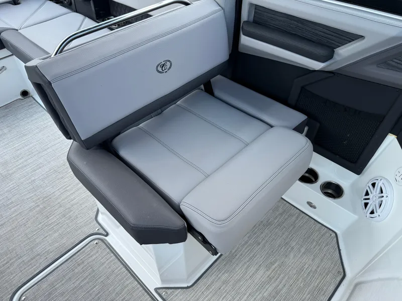 Slide: The Image of 2022 Cobalt R8 boat seat with gray upholstery and cup holders. - 44