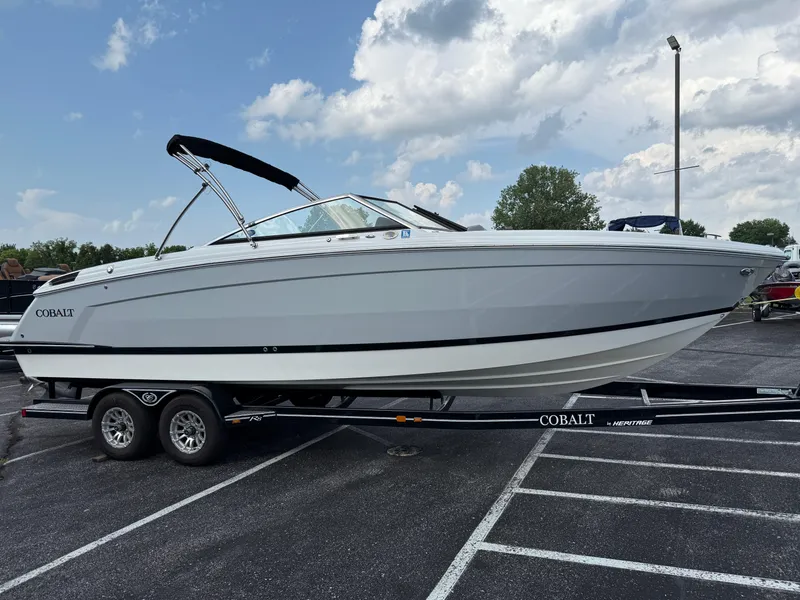 Slide: The Image of 2022 Cobalt R8 boat on trailer in parking lot under cloudy sky. - 5