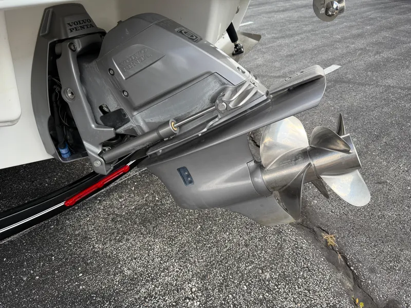 Slide: The Image of Close-up of a 2022 Cobalt R8 boat's Volvo Penta outdrive and propeller. - 8