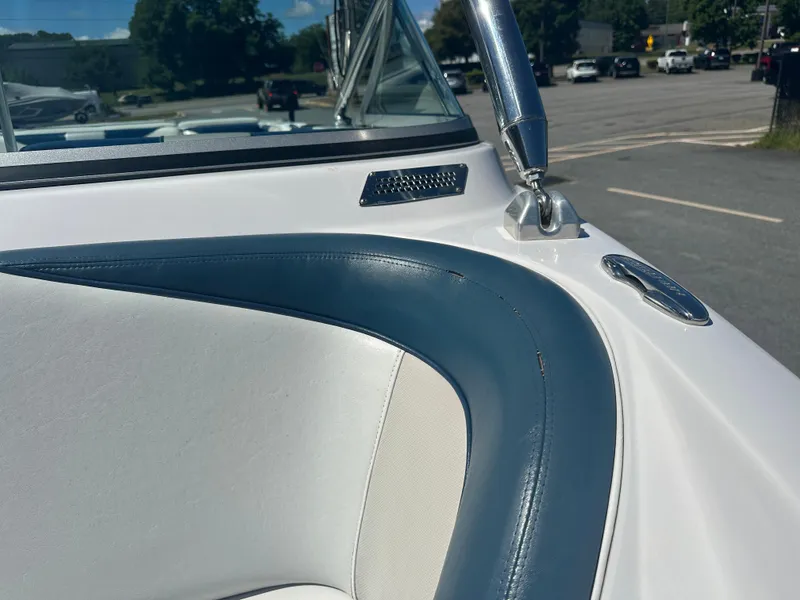 Slide: The Image of 2009 Nautique Super Air 210 boat interior with blue and white upholstery detail. - 14