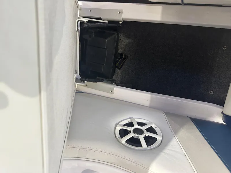 Slide: The Image of 2009 Nautique Super Air 210 interior with speaker and storage compartment. - 26